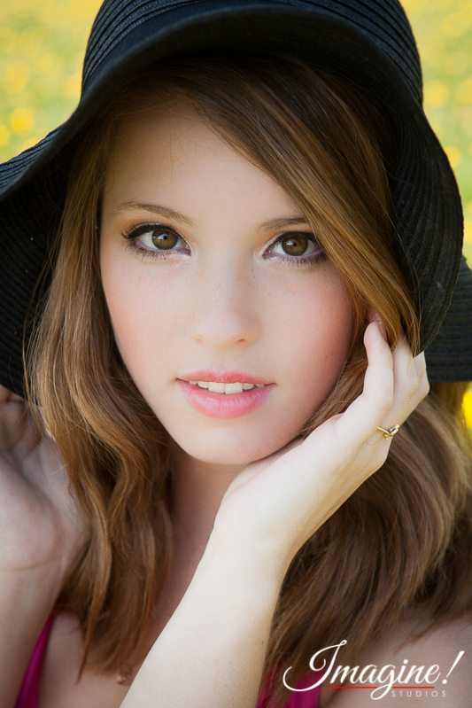 Bethany takes a beautiful closeup during her senior model outdoor photo session in a wildflower field in Greer, SC