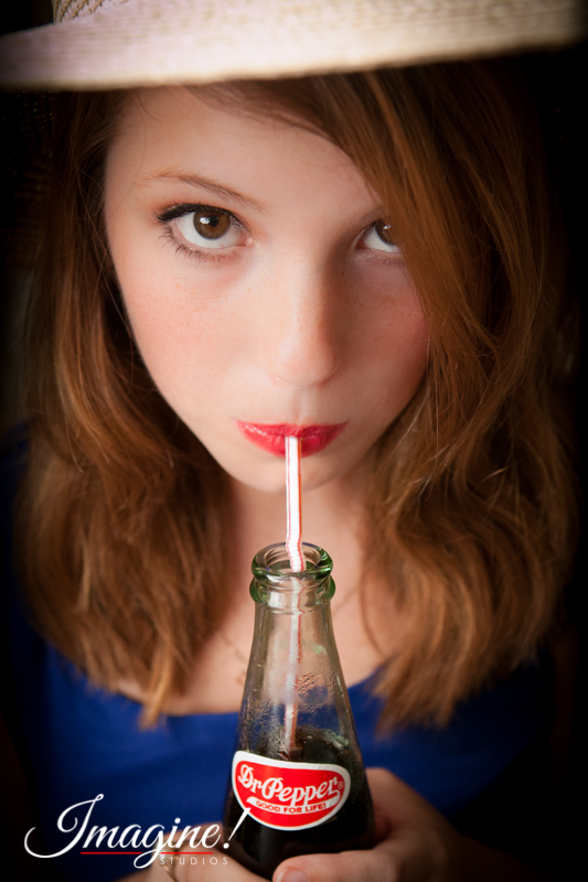 Bethany sips her favorite soda during her senior model outdoor photo session at Highland Lake Inn in Flat Rock, NC