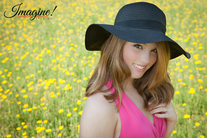 Bethany shows a sweet smile during her senior model outdoor photo session in a wildflower field in Greer, SC