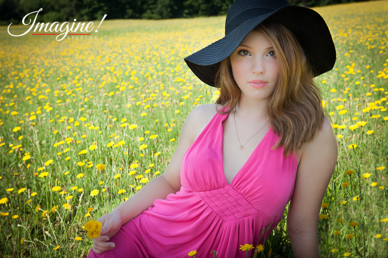Bethany poses for a shot during her senior model outdoor photo session in a wildflower field in Greer, SC