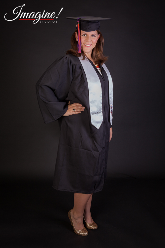 Amethyst poses for a full length studio photo in her cap and gown