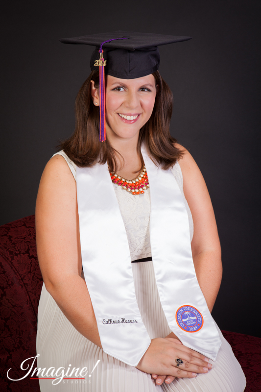 Amethyst shows off her graduation cap and honors regalia