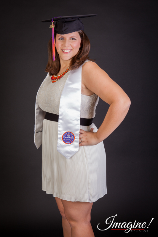Amethyst poses in her pretty white dress and displays her honors graduation sash