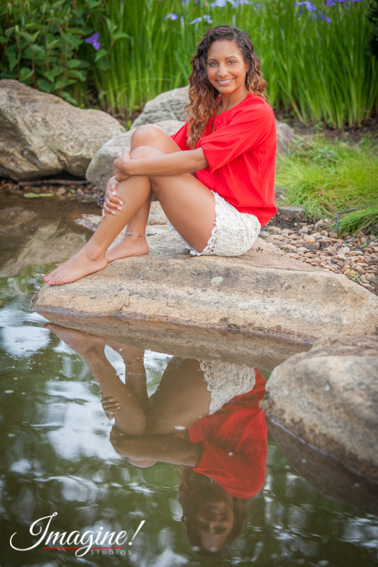 Brianna casts a peaceful reflection on the water in the Japanese Garden at Furman University