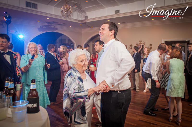 John dances with his grandmother at the wedding reception