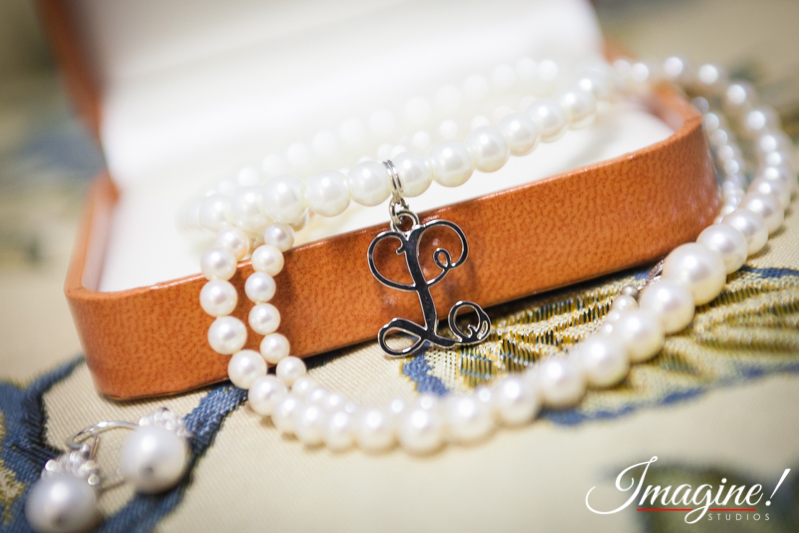 Layne's pearl bracelet and silver monogram charm