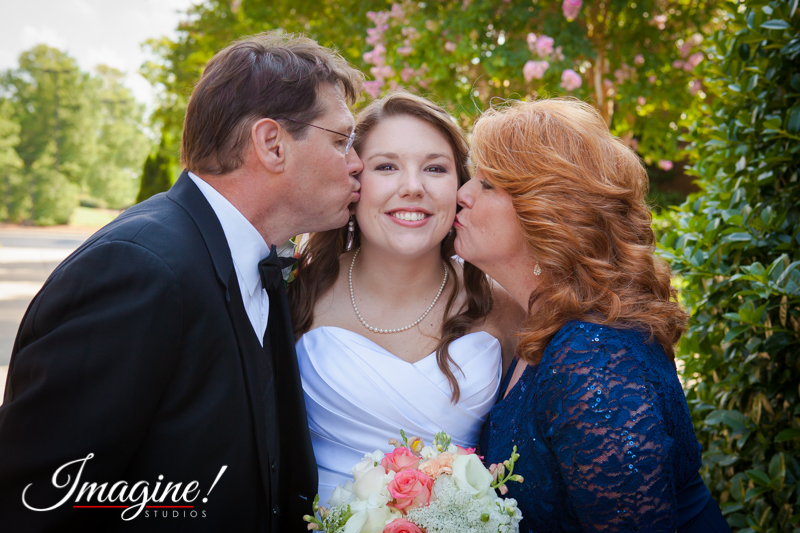 Layne's parents kiss her on the cheek before the wedding ceremony