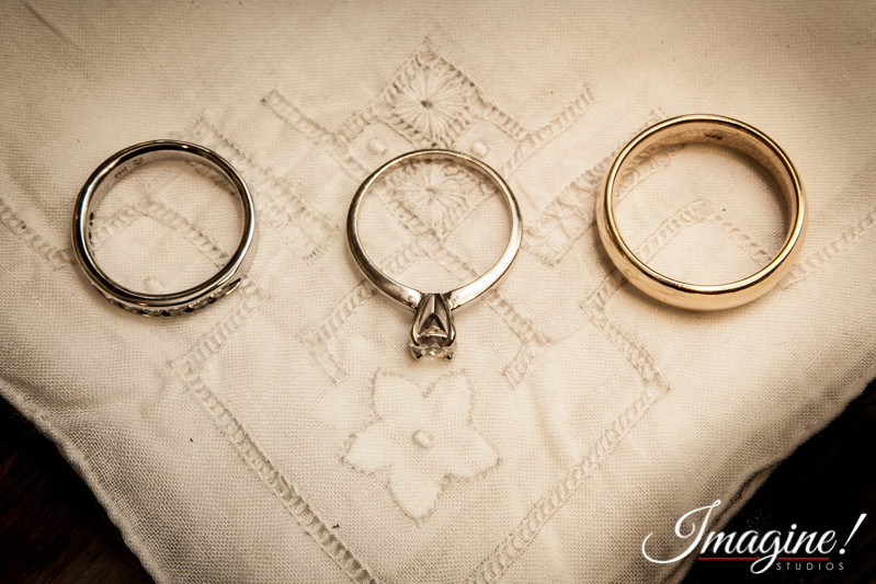 The wedding rings rest on a family handkerchief