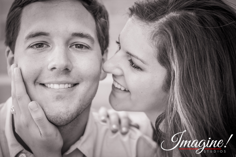 Hannah and Brad share an intimate smile outside Memorial Stadium at Clemson University