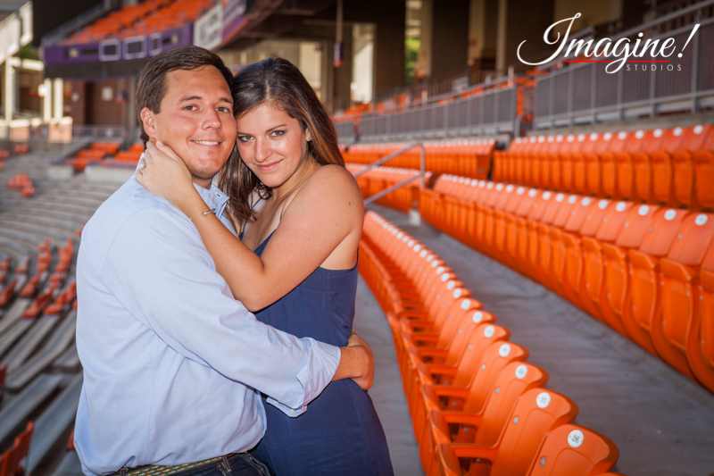 Hannah and Brad relax among the orange seats of the WestZone inside Clemson's Death Valley