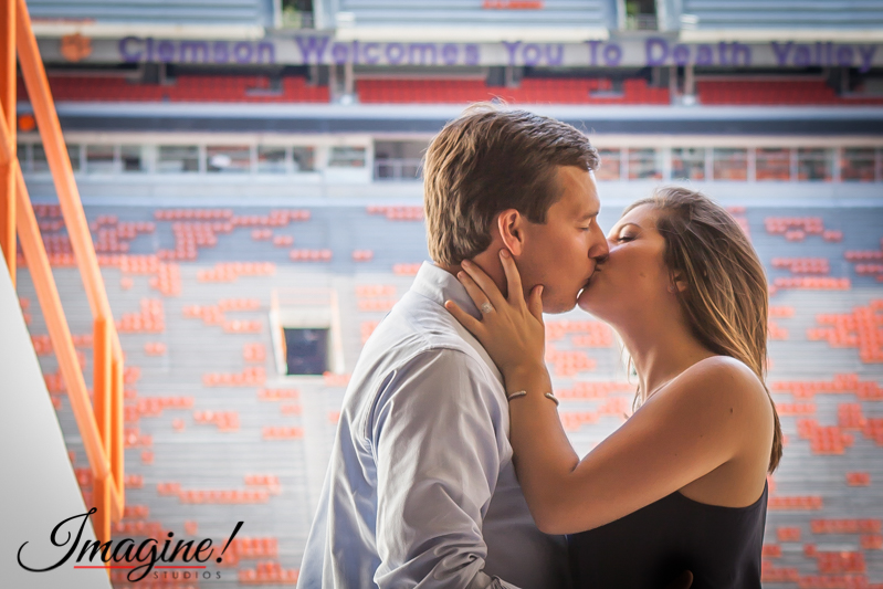 Hannah and Brad kiss in the north stands portal at Clemson Memorial Stadium