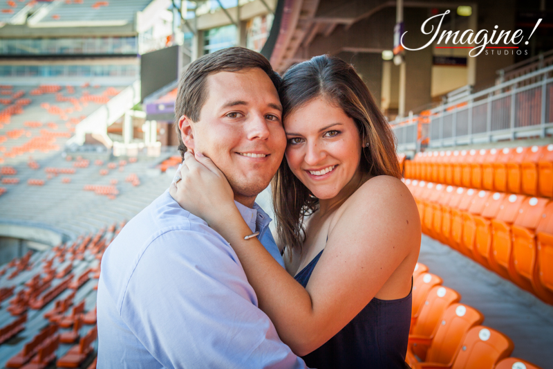 Hannah and Brad embrace in the WestZone at Clemson Memorial Stadium
