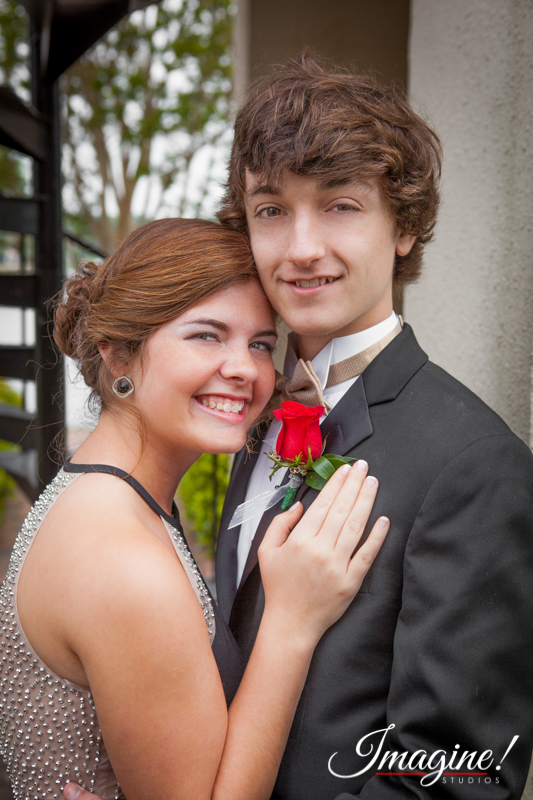 Jacob and Savannah share a close moment outside the Furman bell tower by the campus lake